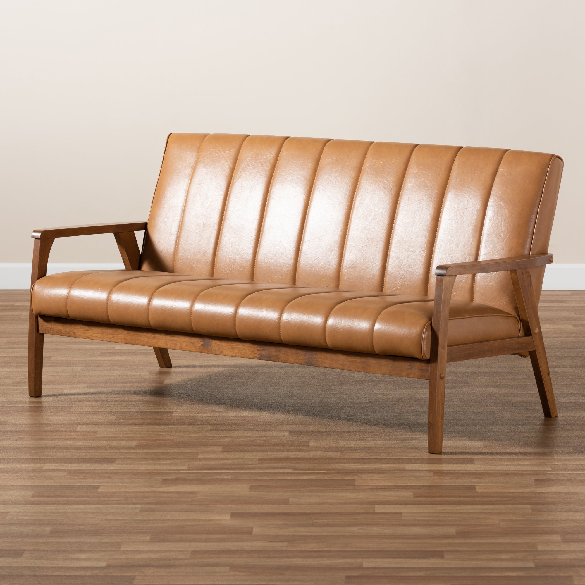 Baxton Studio Nikko Mid-century Modern Tan Faux Leather Upholstered and Walnut Brown finished Wood Sofa