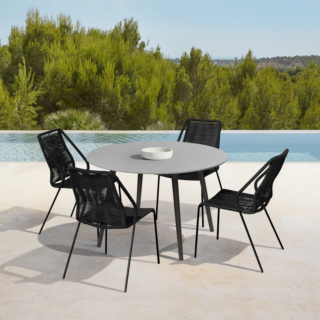 Five Piece Gray and Black Round Stone Dining Set with Four Chairs