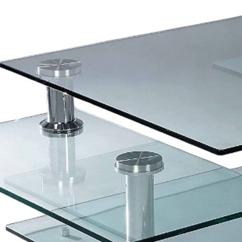 32" Clear and Silver Glass and Metal Coffee Table With Three Shelves