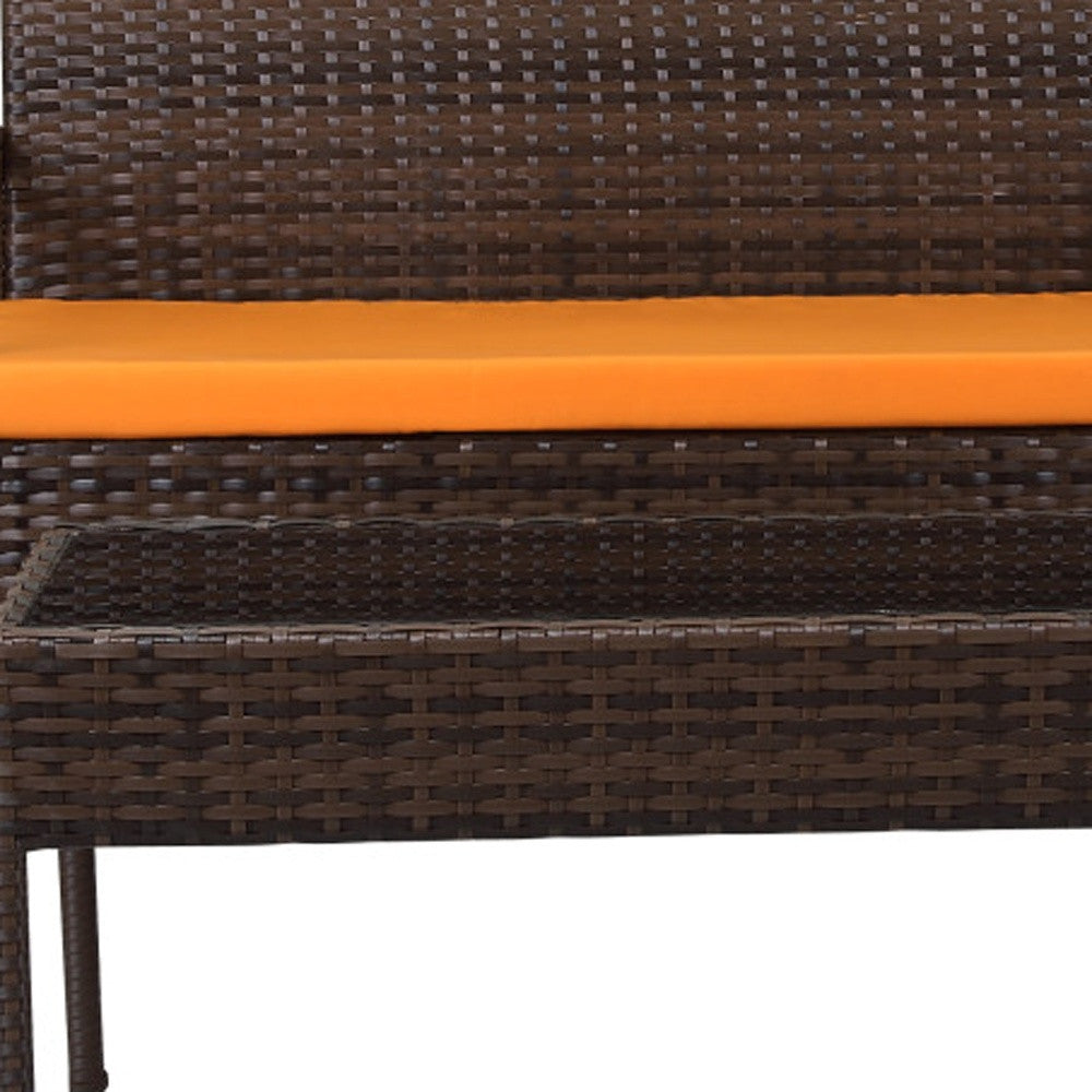 Four Piece Outdoor Dark Brown Wicker Sofa Seating Group with Orange Cushions