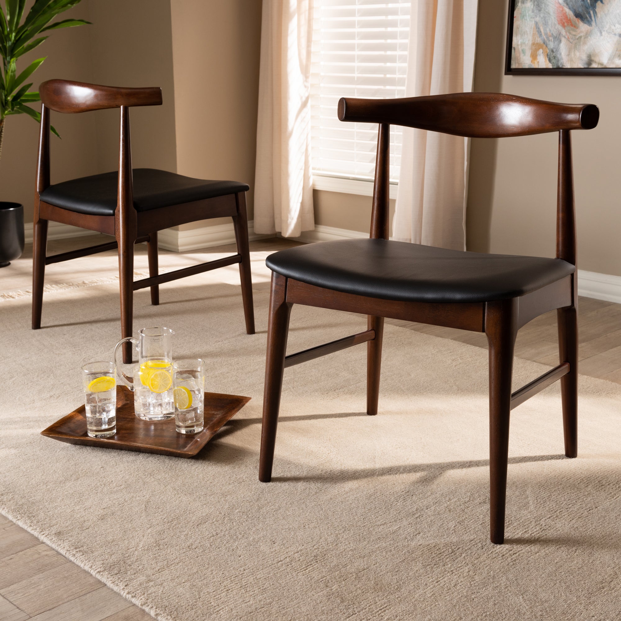 Baxton Studio Eira Mid-Century Modern Black Faux Leather Upholstered Walnut Finished Wood Dining Chair Set of 2