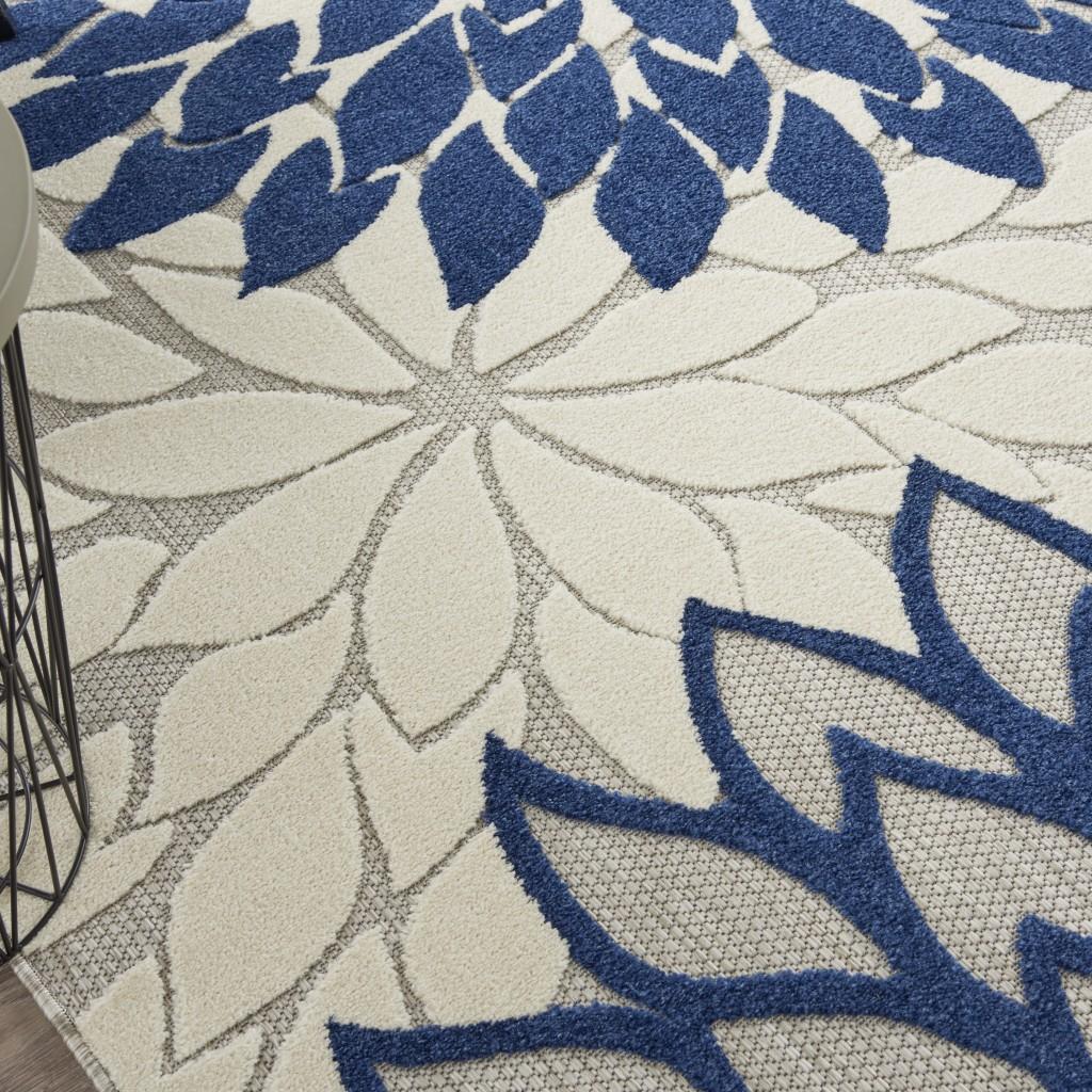 8’ x 11’ Ivory and Navy Indoor Outdoor Area Rug