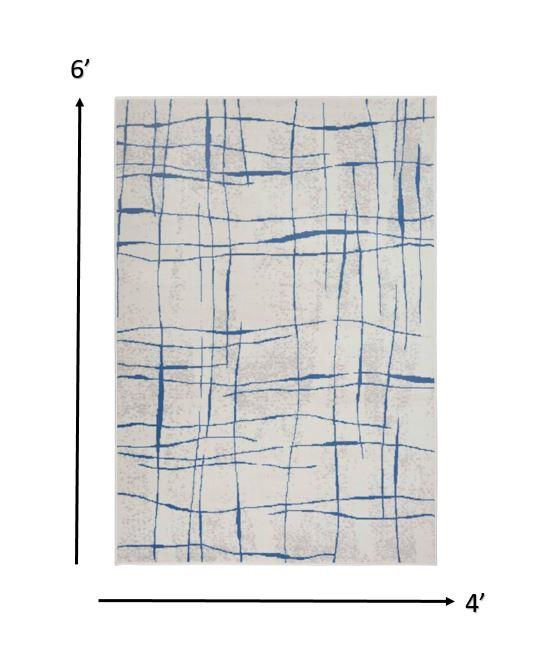 4’ x 6’ Ivory and Blue Irregular Grids Area Rug