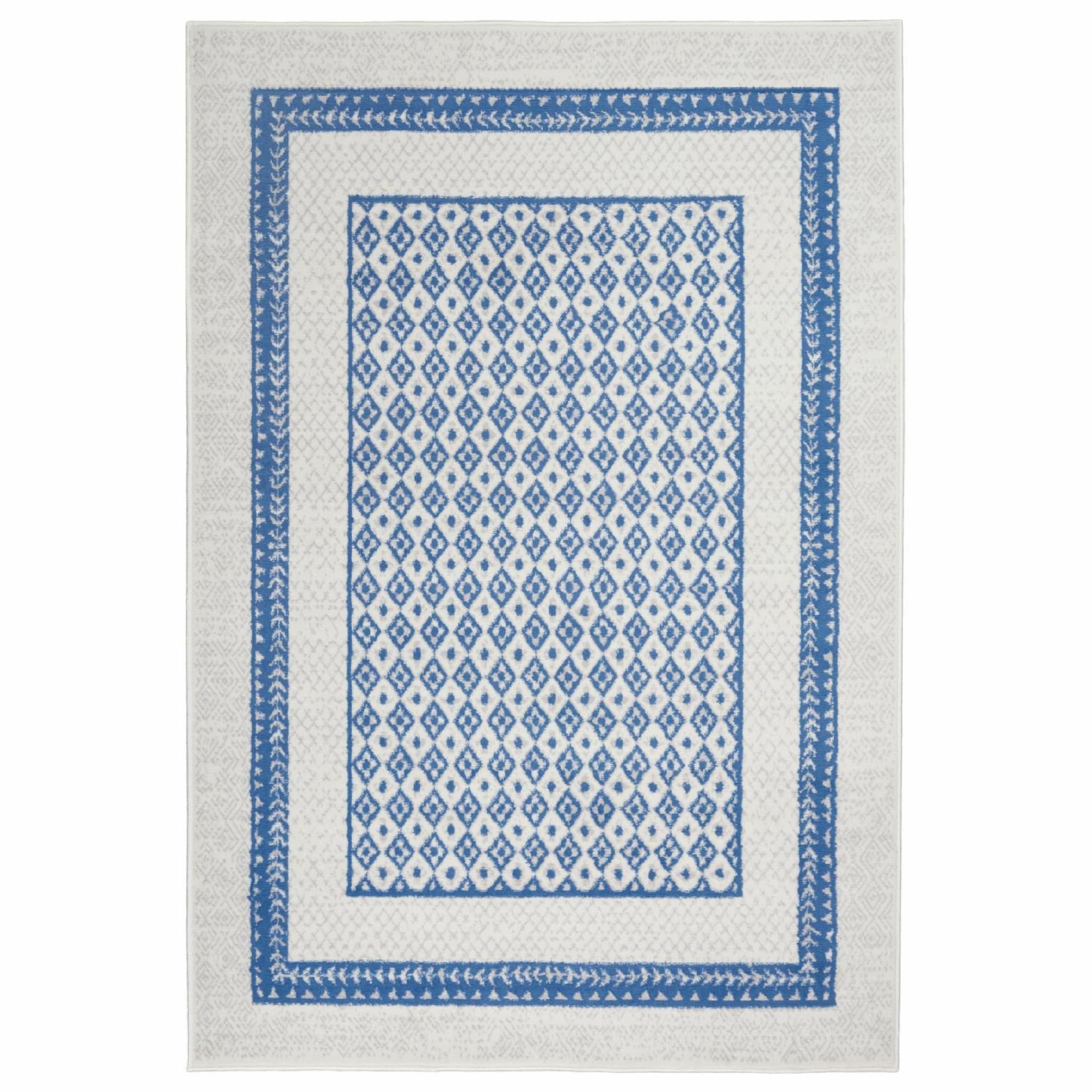 6’ x 9’ Ivory and Blue Geometric Area Rug