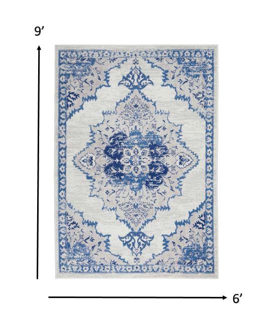 6’ x 9’ Ivory and Blue Medallion Area Rug