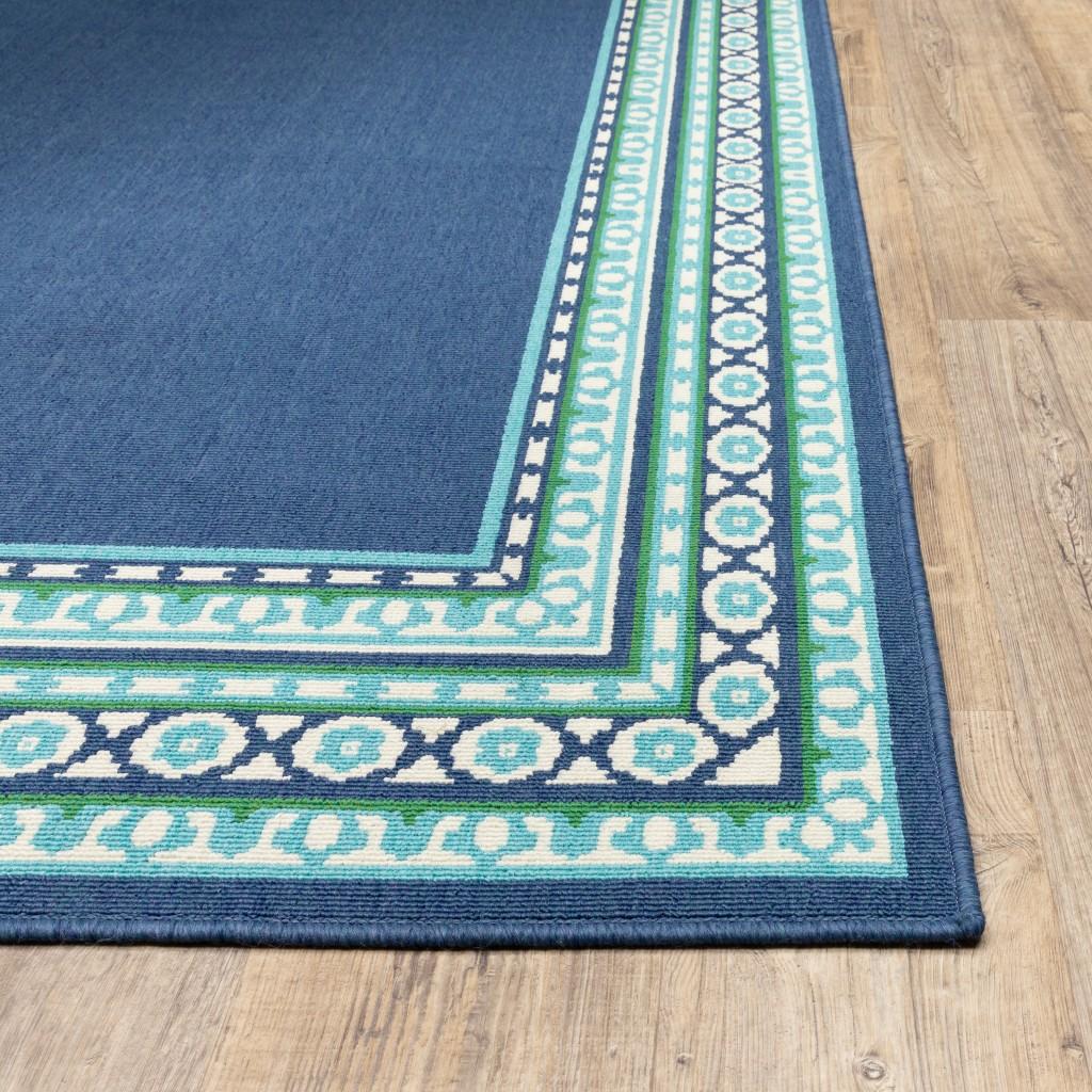 5’x8’ Navy and Green Geometric Indoor Outdoor Area Rug