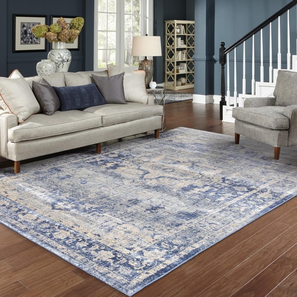 8’x11’ Ivory and Blue Oriental Area Rug