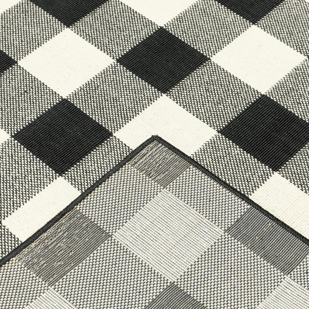 5’x8’ Black and Ivory Gingham Indoor Outdoor Area Rug