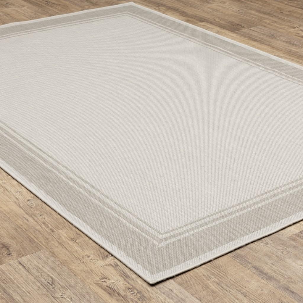 7’x9’ Ivory and Gray Bordered Indoor Outdoor Area Rug