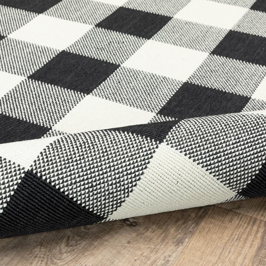 2’x4’ Black and Ivory Gingham Indoor Outdoor Area Rug