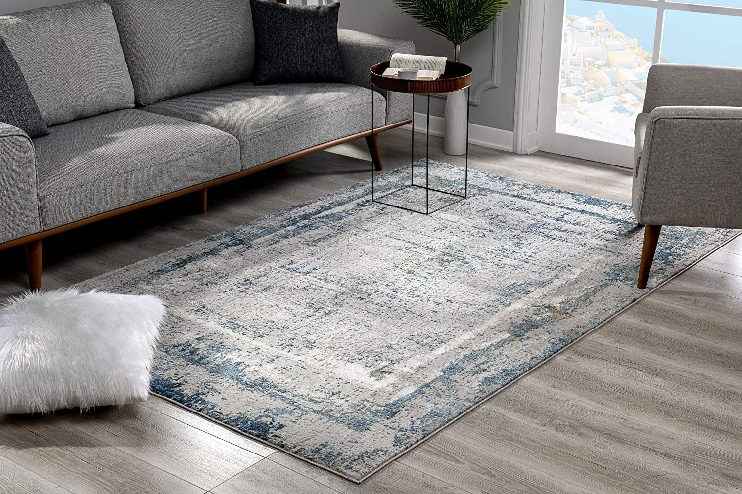 8’ x 11’ Ivory and Blue Abstract Distressed Area Rug