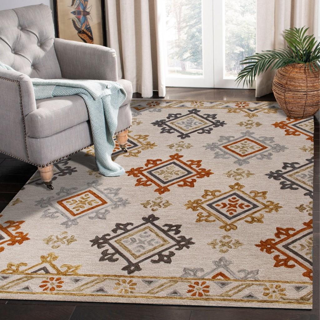 5’ x 7’ Cream and Orange Ornate Diamond Area Rug