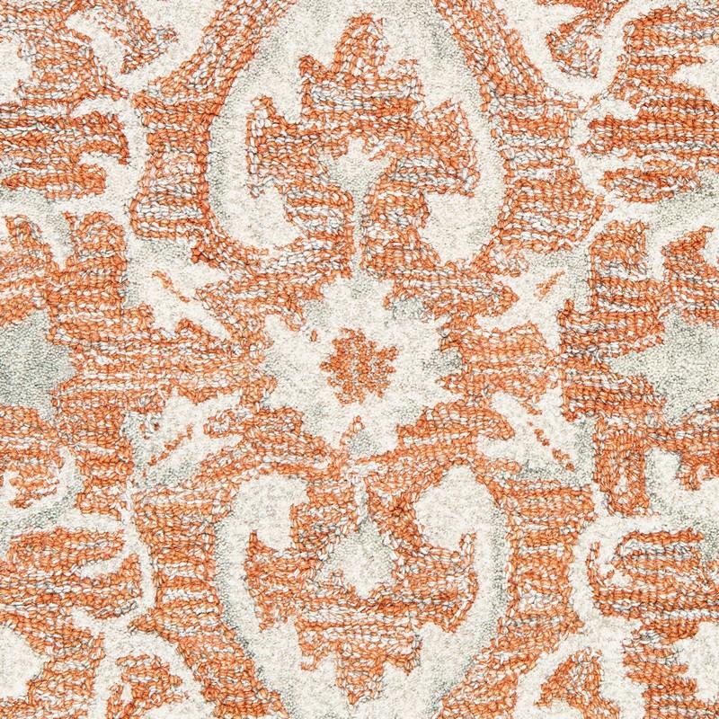 9’ x 12’ Orange and Ivory Medallion Area Rug