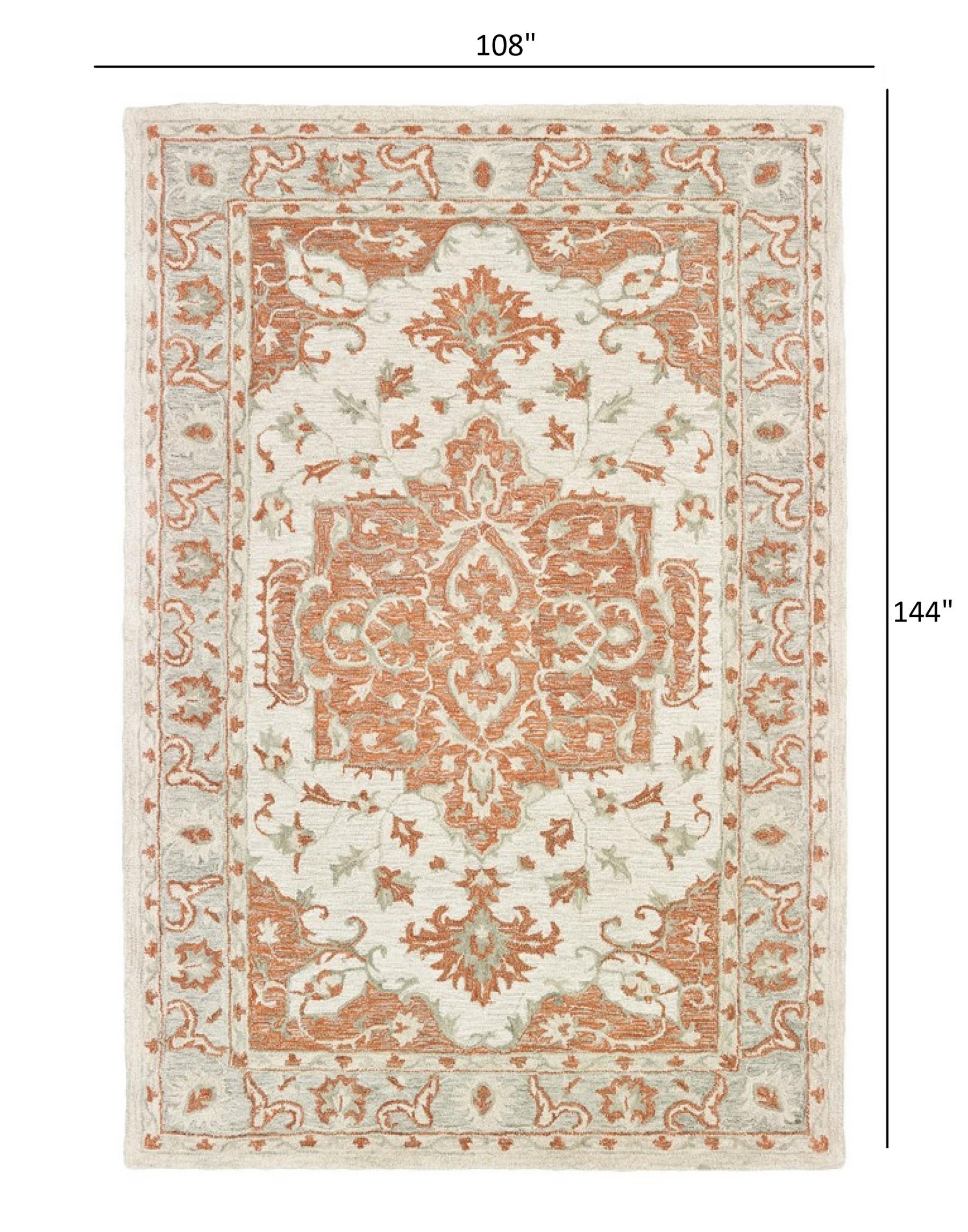 9’ x 12’ Orange and Ivory Medallion Area Rug