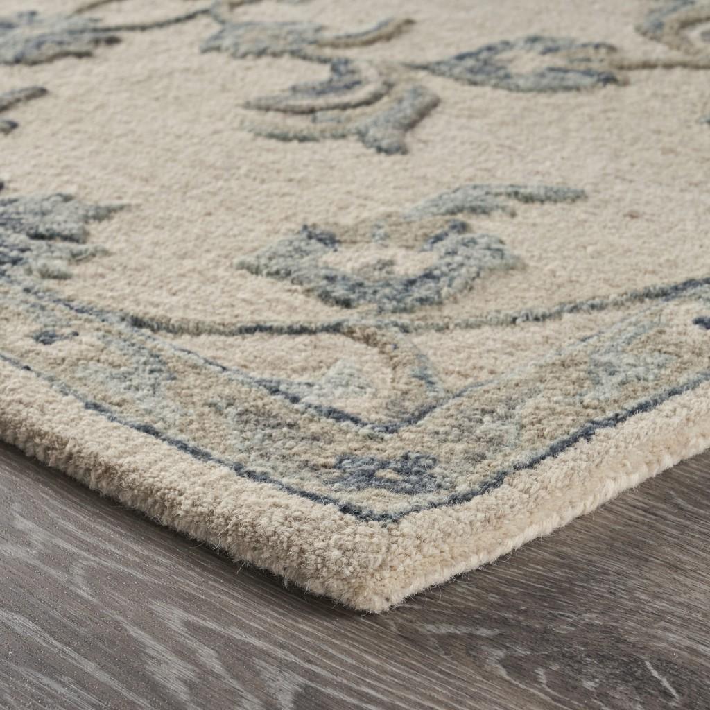 7’ x 9' Beige and Blue Filigree Area Rug