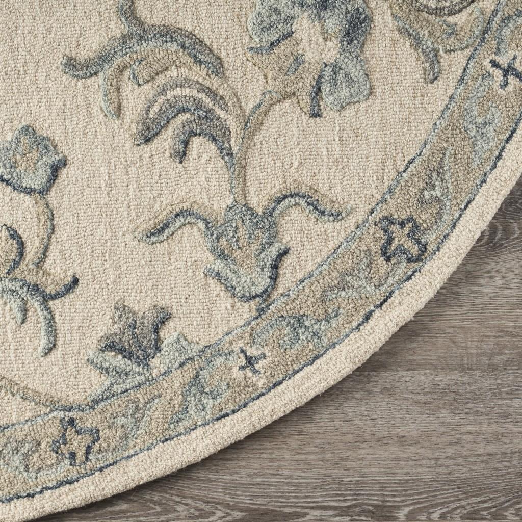 7’ Round Beige and Blue Filigree Area Rug