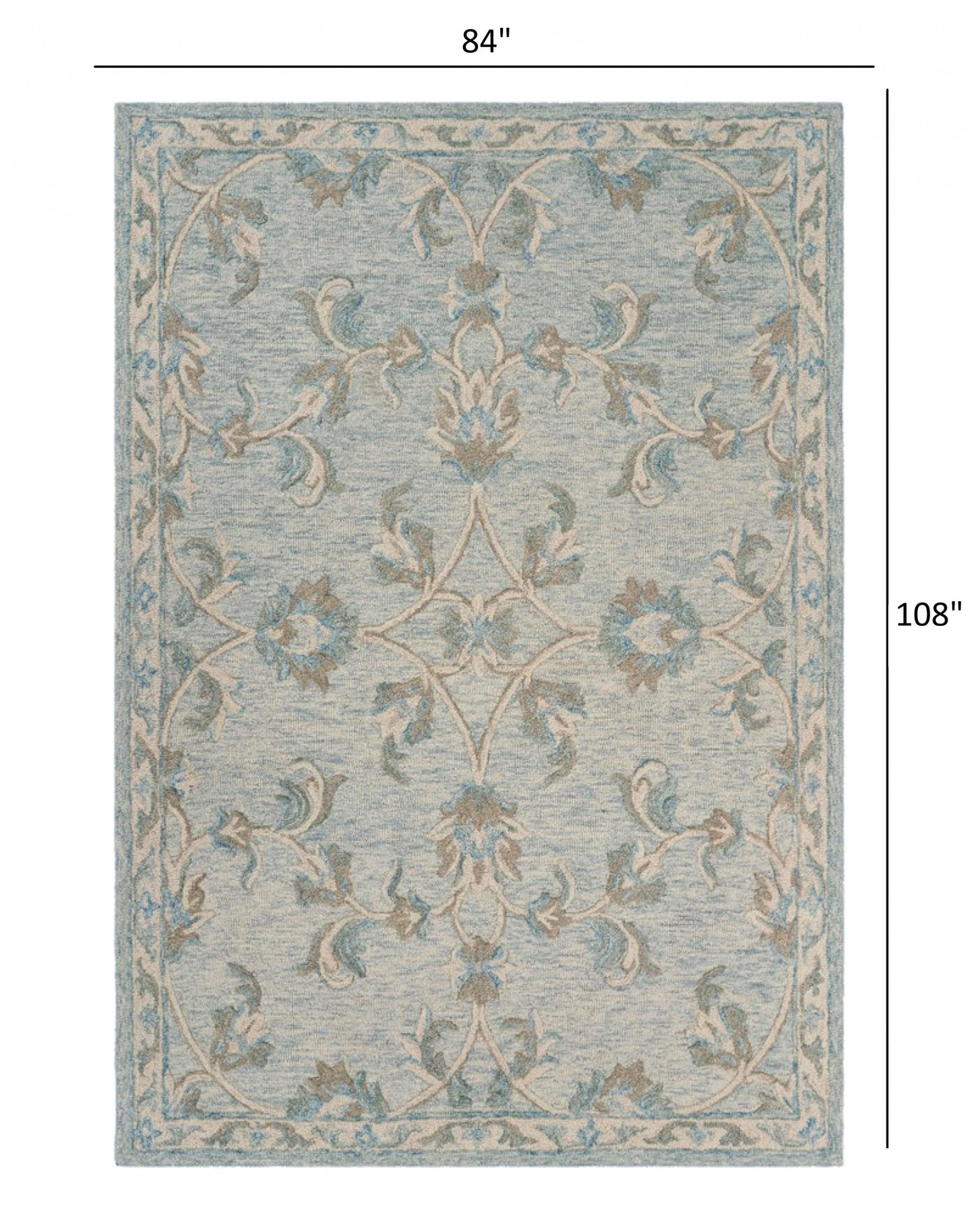 7’ x 9’ Blue and Cream Filigree Area Rug